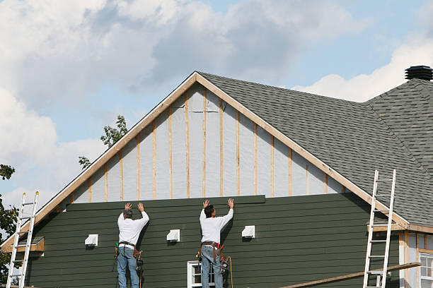 Professional Emergency Siding Repair technician working in Wheaton, MN